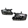 Φανάρια εμπρός Mitsubishi Pajero (2001-2006) - μαύρα , με λάμπες (Η1) - σετ 2τμχ.