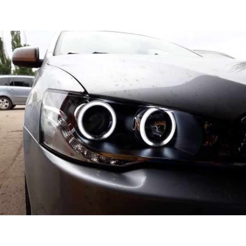 Φανάρια εμπρός led angel eyes για Mitsubishi Lancer (2008-2013) - μαύρα , με λάμπες (Η1) - σετ 2τμχ. Φανάρια εμπρός led angel eyes για Mitsubishi Lancer (2008-2013) - μαύρα , με λάμπες (Η1) - σετ 2τμχ.