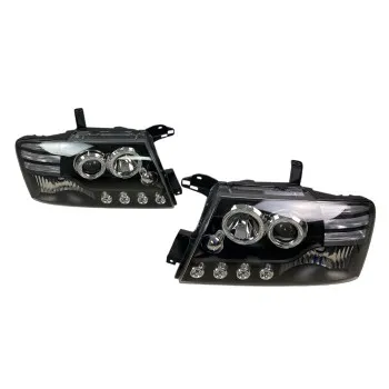 Φανάρια εμπρός Mitsubishi Pajero (2001-2006) - μαύρα , με λάμπες (Η1) - σετ 2τμχ.